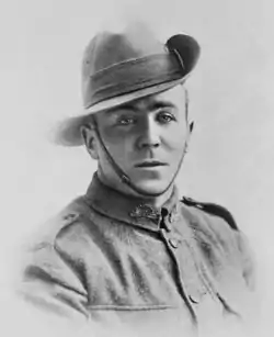 a black and white portrait of a male in uniform