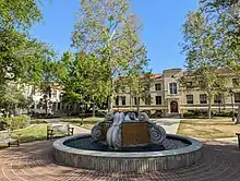 Circular fountain with paths radiating out to academic buildings