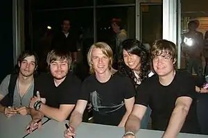 Left to right: David Crisp, Gordie Cochran, Jon Neufeld, fan, Tim Neufeld