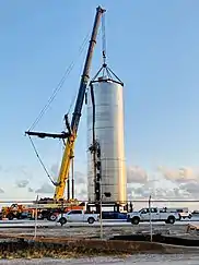 Photograph of a crane hooking onto a steel vessel body