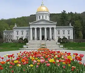 Image 51The gold leaf dome of the Vermont State House in Montpelier is visible for many miles around the city. This is the third State House on the site, and like the second, was built in the Greek Revival architectural style. It was completed in 1857. Montpelier became the state capital in 1805. (from History of Vermont)