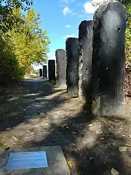 Dark stone obelisks in Magnuson Park, part of an art installation called Straight Shot