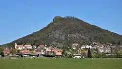 The village of Třebušín under Kalich Hill