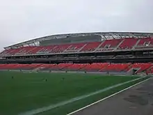 Photo of stadium grandstand with press box near the top