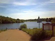 Forge Mill Lake, which is fed by the River Tame. The RSPB reserve is on the far side, and the bird hide is just visible, in the centre of the photograph.