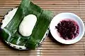 Tapai ketan (right) served with uli (glutinous rice cooked with grated coconut, and mashed;  left)