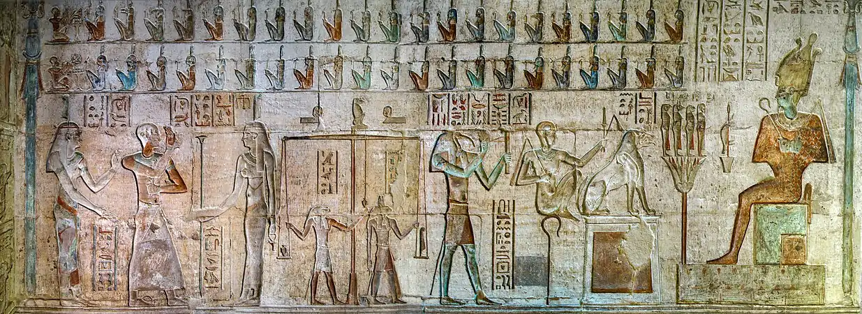 All 42 Judges of Maat are depicted above this scene of psychostasia from the Temple of Hathor at Deir el-Medina. Each of them has on his head the ostrich feather of their mistress Maat.