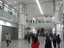 Image of multiple people walking on a shopping mall