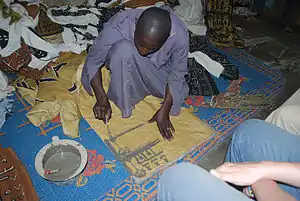 Image 10A textile artisan at work in Djenne, Mali. (from Culture of Mali)