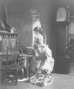 "Sarony's Centennial Tableaux", showing young woman making U.S. Flag on sewing machine, c. 1876