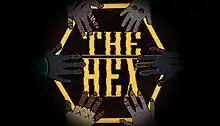 Six hands placed down on a table in a circle, surrounding the words "The Hex".