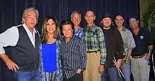 The Sons of Champlin in 2014. Left to right: Bill Champlin, Tamara Champlin, Carmen Grillo, Richard Mithun, Geoffrey Palmer, Alan Hertz, Jeff Lewis, Tim Cain.