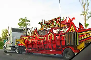 Part of a carnival ride being transported