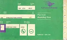 A boarding ticket issued by Garuda Indonesia, colored mainly in green. The ticket is showing a passenger flying GA 150 to Medan. The boarding ticket show that there are non-smoking and smoking sections on the aircraft.