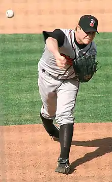 A baseball player in gray