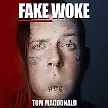 The face of Canadian rapper Tom MacDonald appears, with his mouth digitally removed; above him reads "Fake Woke" and below reads "Tom MacDonald" in an all-caps, white font.