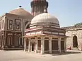 The tomb in the foreground, Alai Darwaza and Qutb Minar at the background