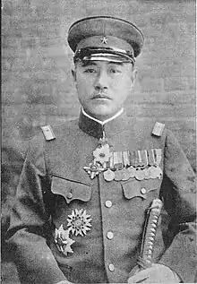 black and white photograph of a Japanese man wearing an army officer's uniform