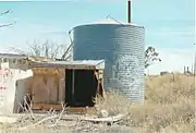 Tank behind the abandoned Twin Arrows Trading Post.