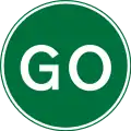 Go ahead or proceed for temporary road works using a hand sign