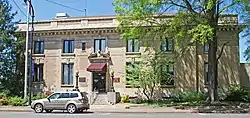 Wide two-story tall stone building