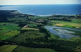 View of lake, surrounding countryside and sea