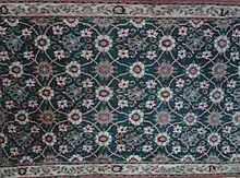 A carpet with Minakhani motif