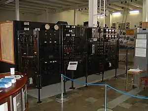 Interior of transmitter hall showing control panel for alternator