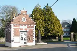 The main square in Vercourt, with the town hall, chateau and war memorial