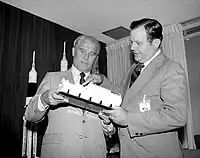 Von Braun and William R. Lucas, the first and third Marshall Space Flight Center directors, viewing a Spacelab model in 1974; von Braun's proposals for the development of astronautics were not accepted, and priority was given to the space shuttle program instead