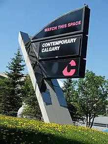 Photograph of a sign outside of the gallery that reads "Watch this space" and "Contemporary Calgary"