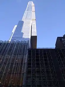 Central Park Tower's eastern facade cantilevers over the American Fine Arts Society, headquarters of the Art Students League of New York