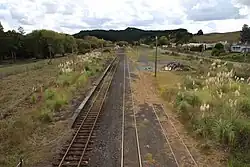 View of the former Waiotira railway station from the Mititai Road overbridge, with some of the township at right.