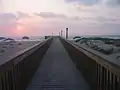 This walkway provides access to the beach from a condo.