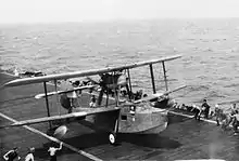 photograph of a Walrus landing on a ship