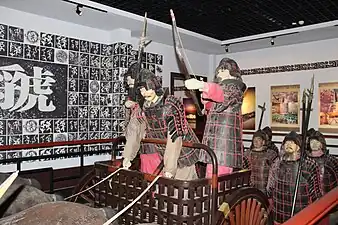 Museum reconstruction of Zhou dynasty charioteers in full armor.