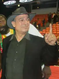 New IBO International middleweight champion Osumanu Adama (center) with his manager Wasfi Tolaymat in the ring at UIC Pavilion in Chicago, December 2010