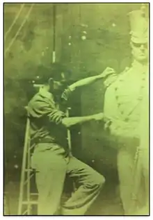 John A Wilson in studio sculpting Washington Grays Monument, Boston