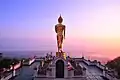 The standing Buddha of Wat Phra That Khao Noi overlooks Nan