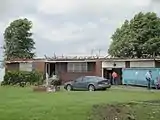 EF2 damage example--At this intensity, tornadoes have a more significant impact on well-built structures, removing the roofs, and collapsing some exterior walls of poorly built structures. EF2 tornadoes are capable of completely destroying mobile homes, garages, and barns and generating large amounts of flying debris. This home completely lost its roof, but its walls remained intact.