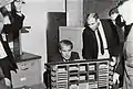 MSFC officials, including Dr. Wernher von Braun (on left) looking at an LVDC