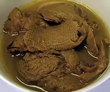 Photo of vegetarian "mock duck" made of wheat gluten in a brine with seasonings.