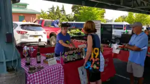 A booth for the White Tail Run Winery at a farmers' market in Overland Park, Kansas.