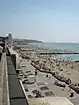 The beach crowded with people at lower tide