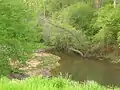 Bear Creek runs southwest of Woodland, Alabama