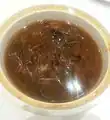 Imitation shark fin soup is a popular street snack invented in Hong Kong. It looks like shark fin soup but doesn't use actual shark fins. The soup is either made with synthetic shark fins, cellophane noodles, konjac gel, or other alternatives.