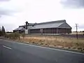 Silo at edge of township (on railway line)