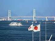 Yokohama City (left) and the Hinomaru (center) flying on Yokohama Harbor