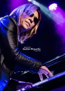 Yoshiki performing the piano while attending a Q&A session in SanFancisco promoting the film We Are X.