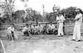 Group of Japanese descendants with Brazilians working resting after tree cutting, to clear areas for coffee plantations in Brazil, '50s and '60s.